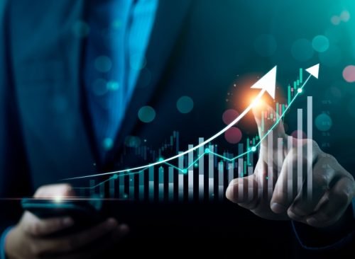 Businessman,Using,Laptop,And,Analyzing,Economic,Growth,,Financial,Graph,And