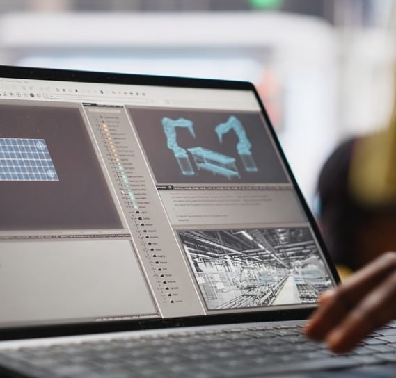 Solar,Panels,Male,Worker,Analyzing,Performance,Data,On,Laptop,And